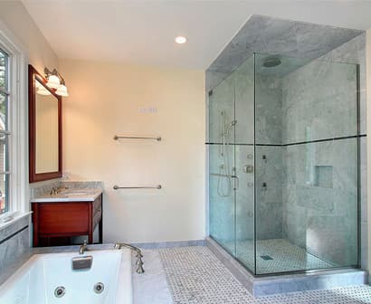 Custom frameless glass shower door installed by Geet Glass & Closet